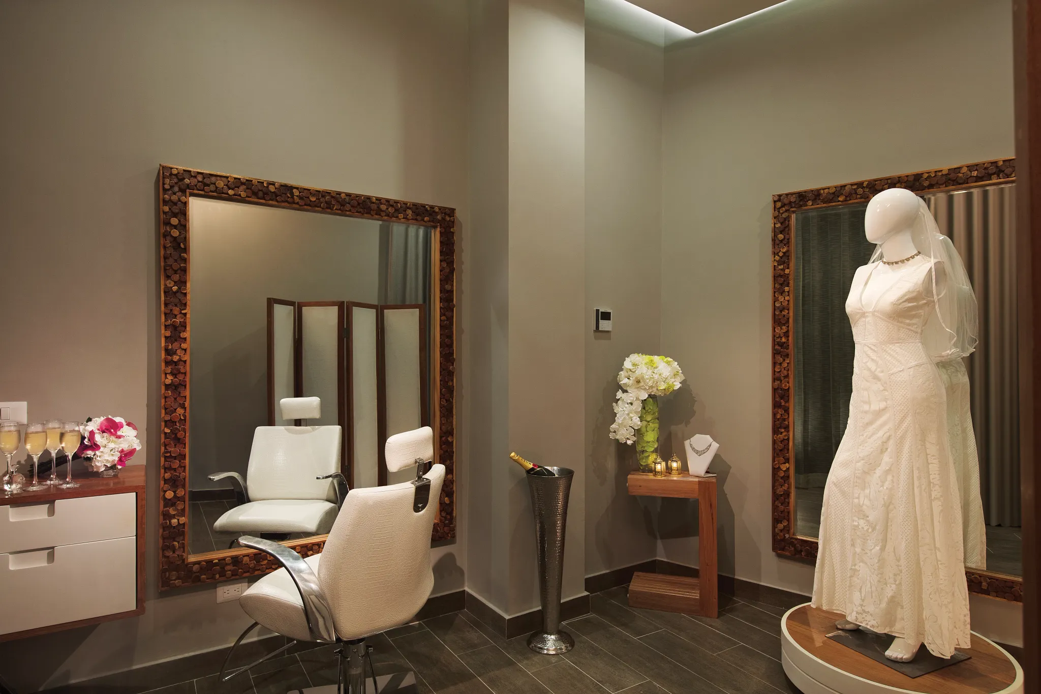 Elegant bridal preparation room with wedding dress display at Dreams Dominicus La Romana spa.