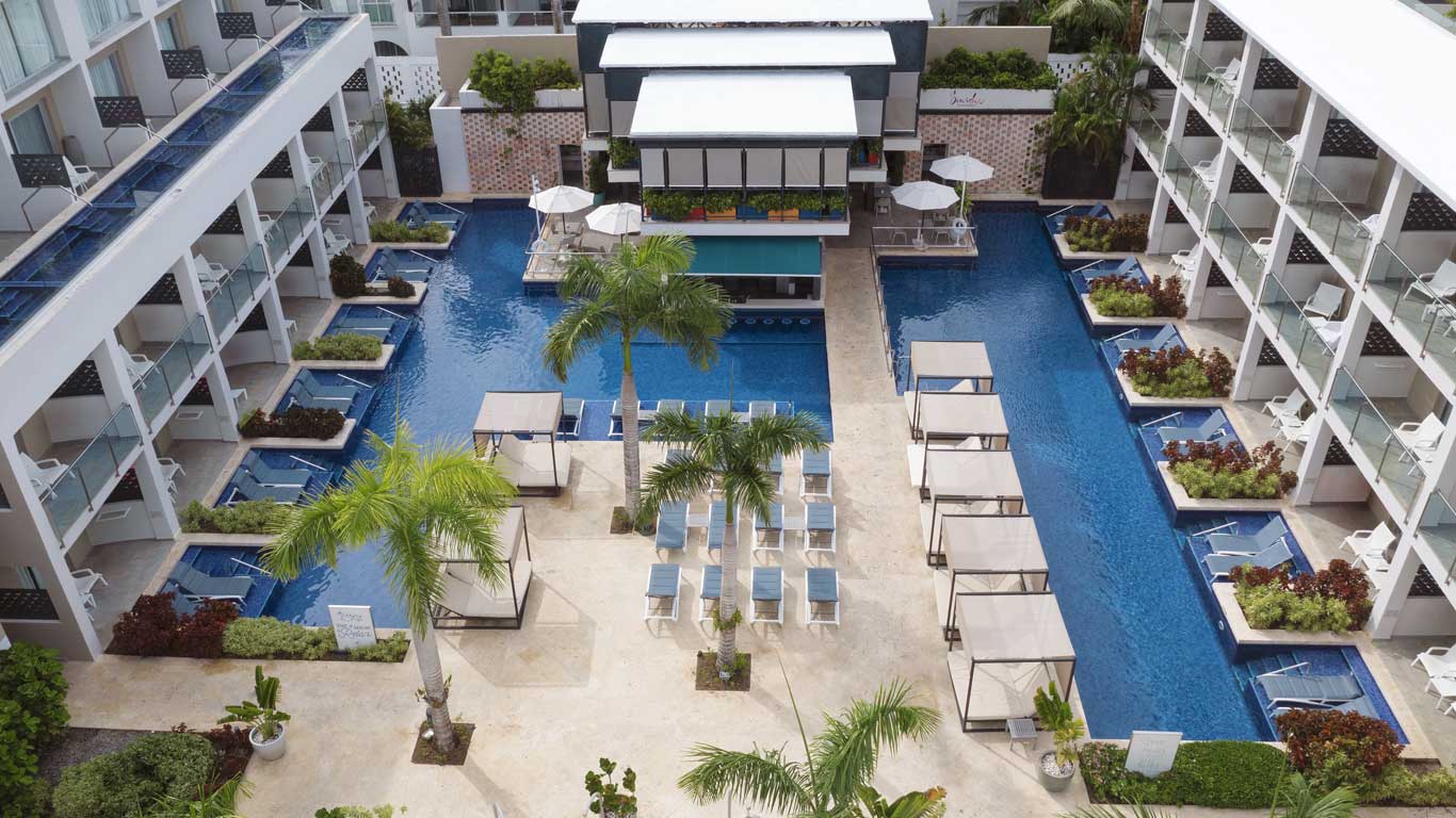 Catalonia Royal La Romana adults-only all-inclusive resort in Dominican Republic with beachfront pools and tropical gardens.