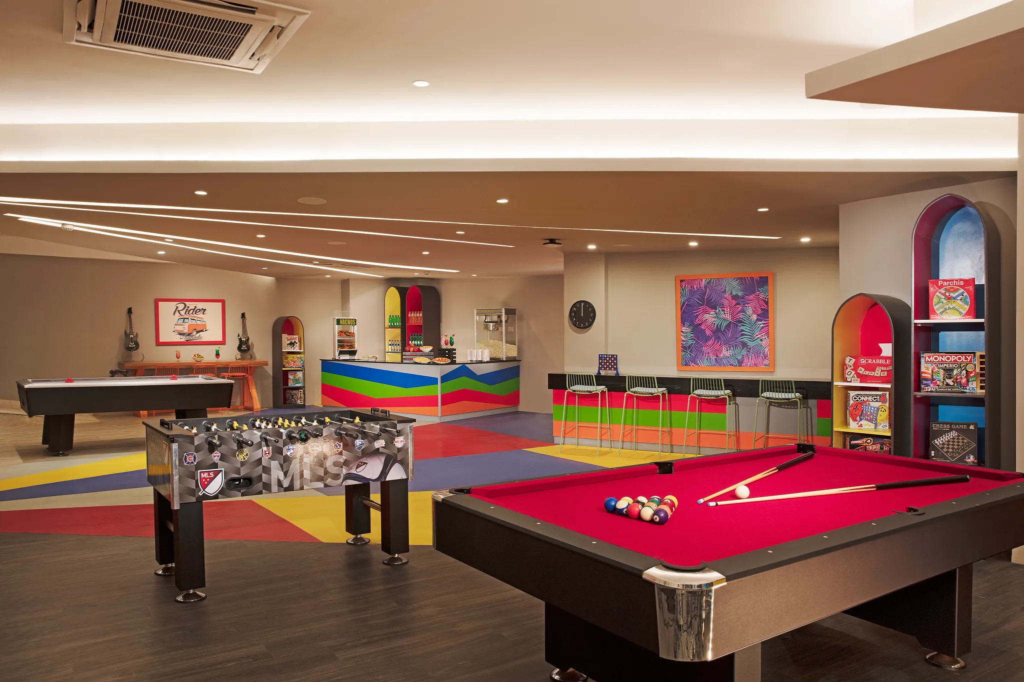 Modern teen lounge with billiards, foosball, and games at Dreams Dominicus La Romana Resort.