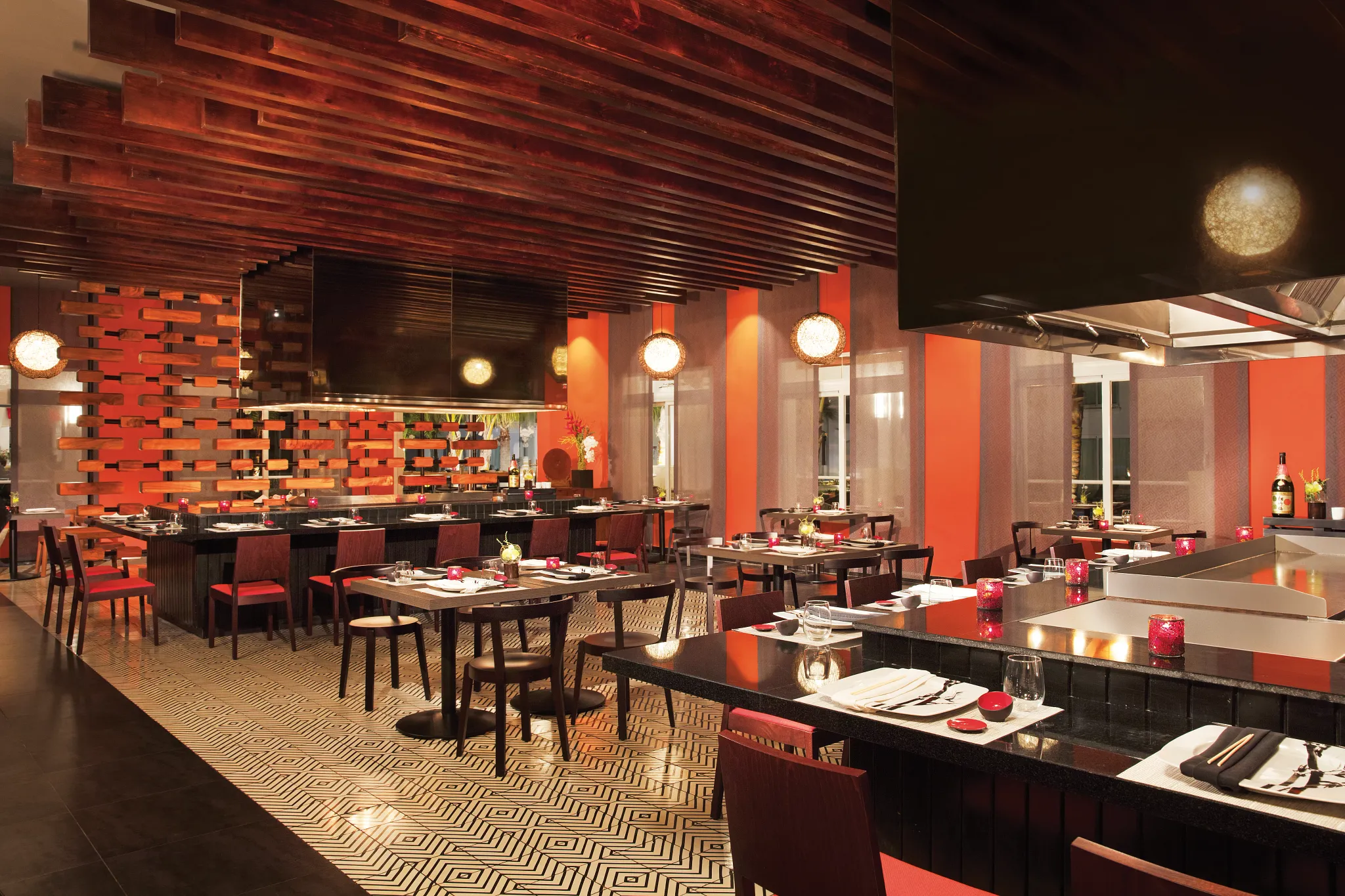 Himitsu Asian restaurant at Dreams Dominicus La Romana featuring contemporary teppanyaki tables, sushi bar, and elegant Asian-inspired décor.