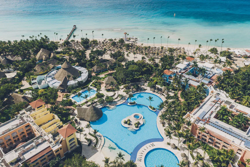 Iberostar Selection Hacienda Dominicus all-inclusive resort in Bayahibe, Dominican Republic with beachfront pools, colonial-style architecture, and tropical landscaping.