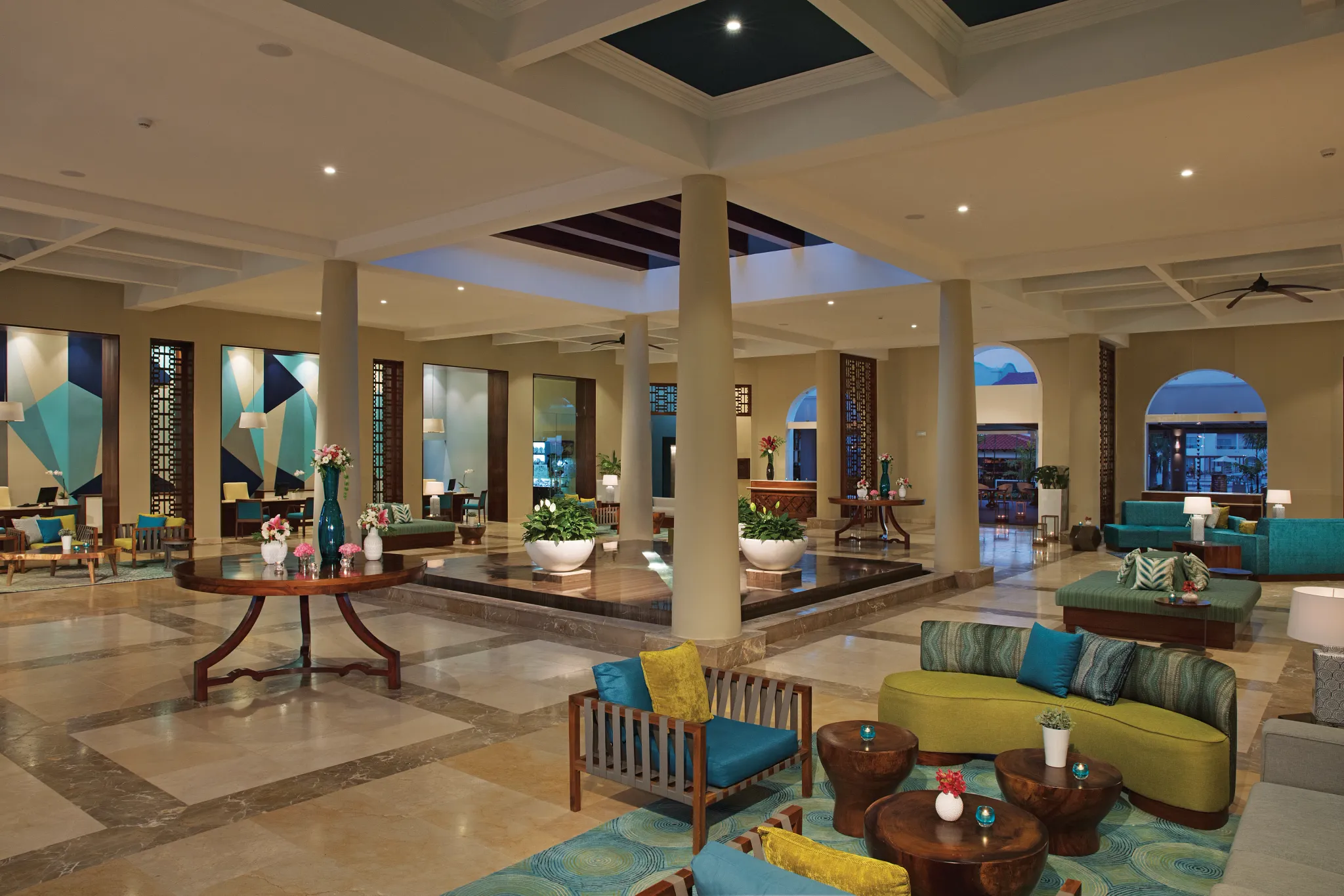 Elegant open-air lobby with modern Caribbean decor at Dreams Dominicus La Romana Resort.
