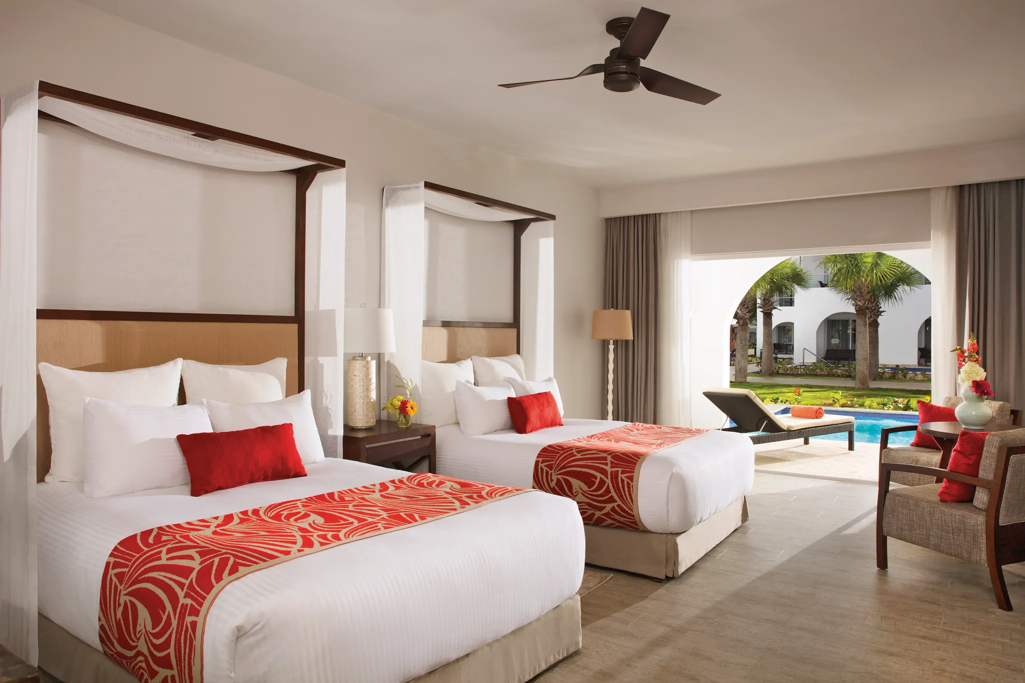 Preferred Club Deluxe Swim-Up room with two double beds and direct plunge pool access at Dreams Dominicus La Romana.