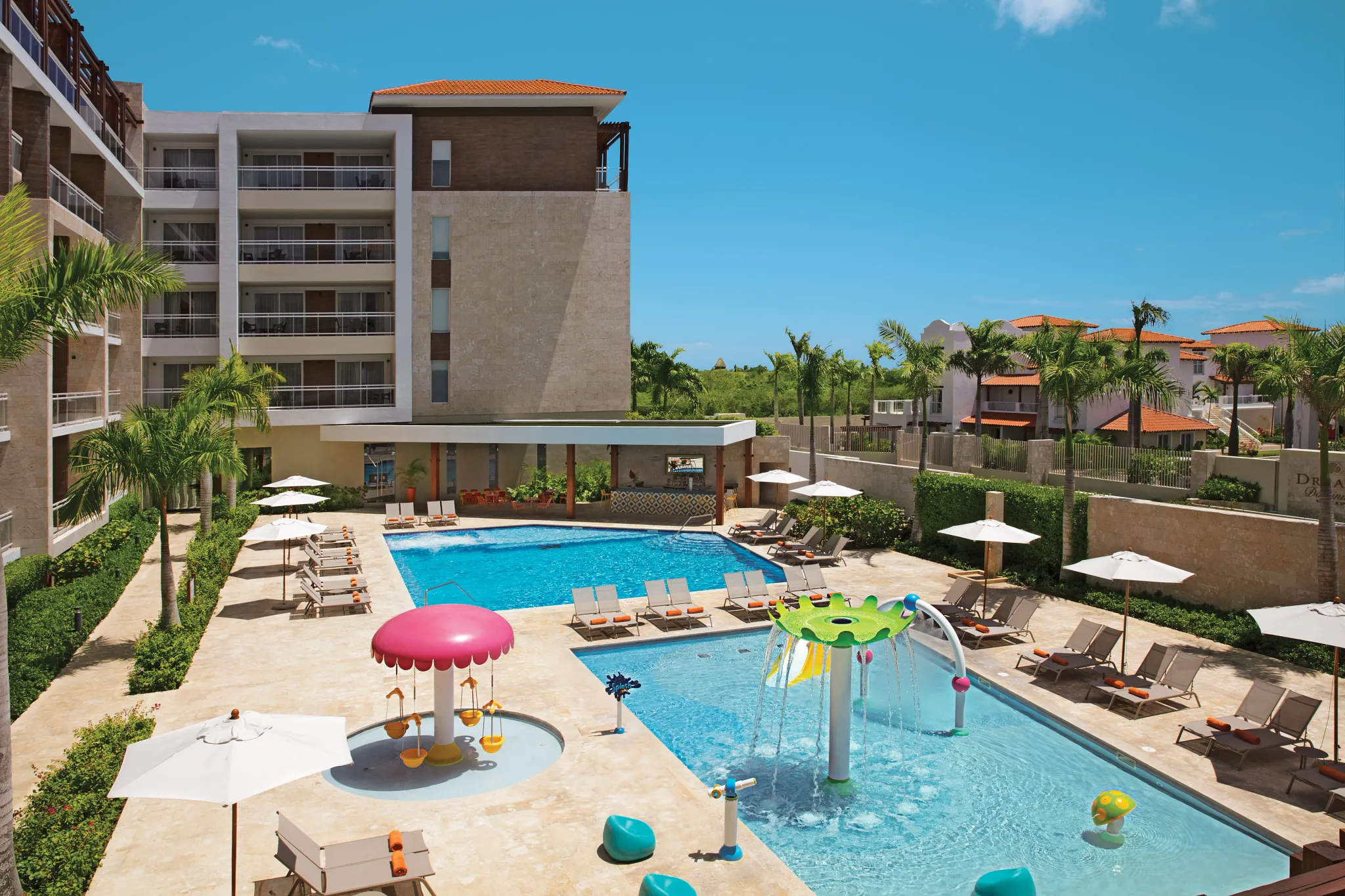 Exclusive pool area with lounge chairs at Dreams Dominicus La Romana Preferred Club section.