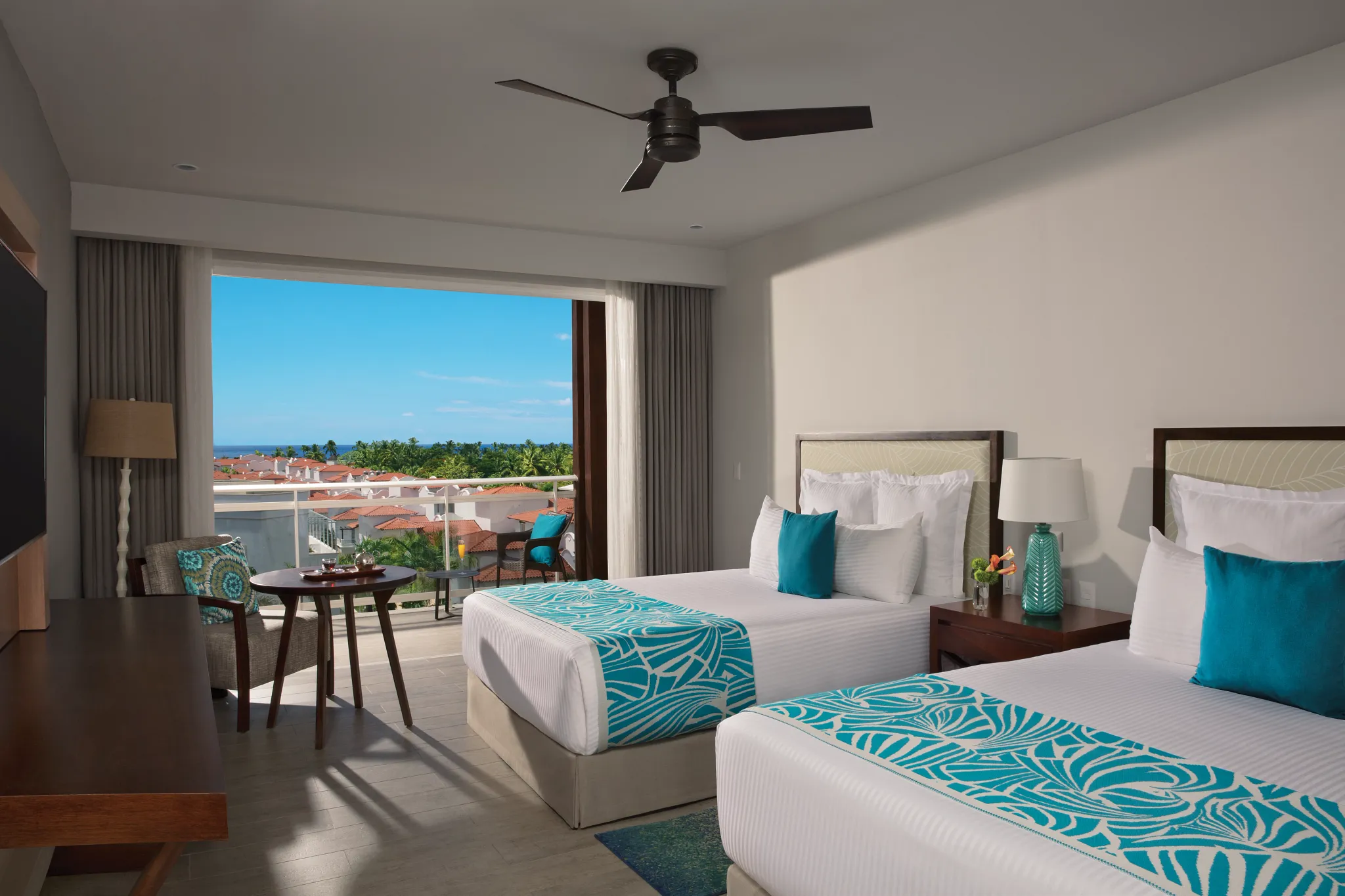 Preferred Club Three Bedroom Family Suite Tropical View with two double beds at Dreams Dominicus La Romana.