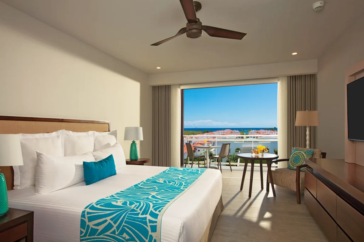 Preferred Club Three Bedroom Family Suite Tropical View with king bed and balcony at Dreams Dominicus La Romana.