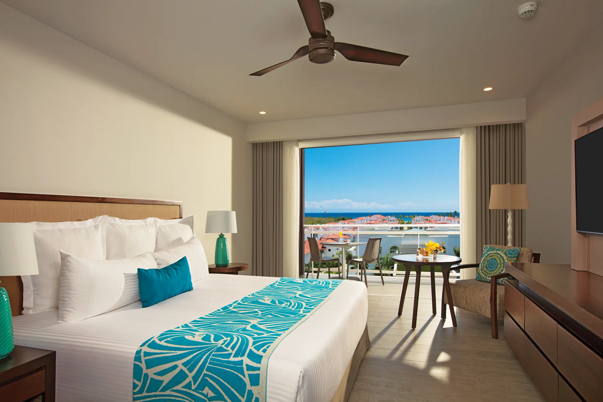 Preferred Club Three Bedroom Family Suite Tropical View with king bed and balcony at Dreams Dominicus La Romana.
