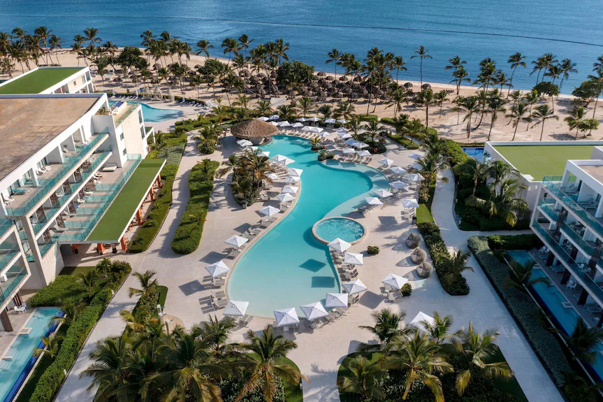 Serenade Punta Cana Beach and Spa Resort all-inclusive property with beachfront pools, tropical gardens, and Caribbean ocean views.